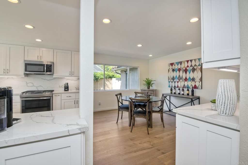 631 Dell Street Solana Beach, CA 92075 - Photo 14 of 36 a kitchen with a table and chairs in it