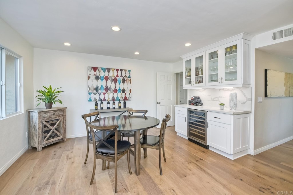 631 Dell Street Solana Beach, CA 92075 - Photo 15 of 36 a view of a dining room with furniture and wooden floor