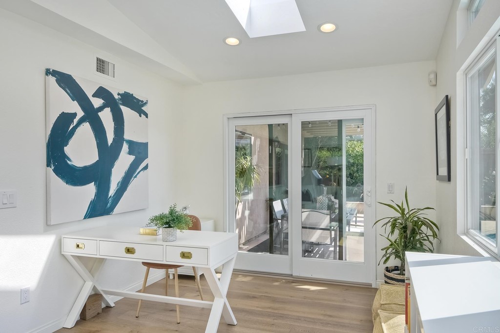 631 Dell Street Solana Beach, CA 92075 - Photo 19 of 36 a view of a dining room with furniture window and wooden floor