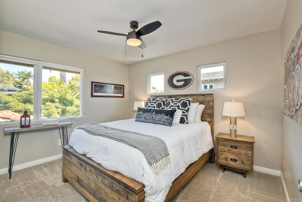 631 Dell Street Solana Beach, CA 92075 - Photo 26 of 36 a bedroom with a bed and a large window