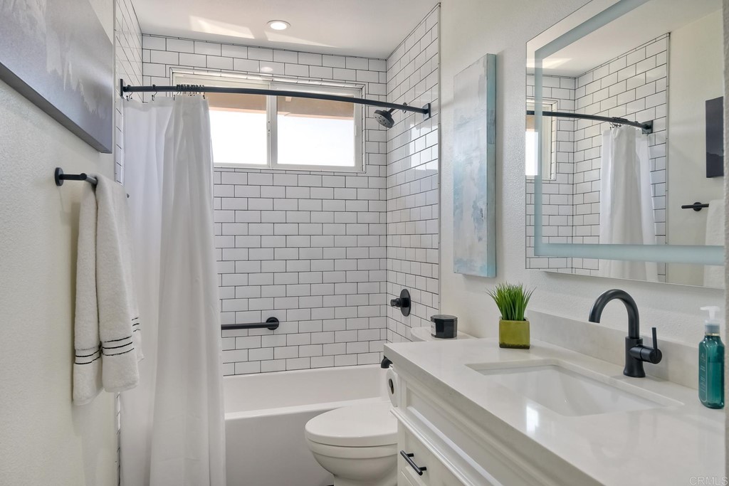 631 Dell Street Solana Beach, CA 92075 - Photo 27 of 36 a bathroom with a sink a toilet and shower
