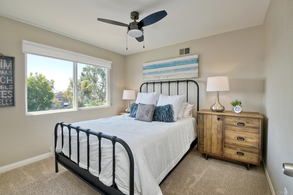 631 Dell Street Solana Beach, CA 92075 - Photo 28 of 36 a large bed sitting in a bedroom next to a window
