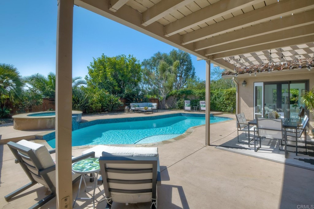 631 Dell Street Solana Beach, CA 92075 - Photo 32 of 36 a view of a patio with a table chairs and a backyard