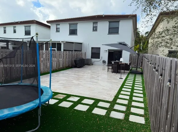 a view of house with patio outdoor seating
