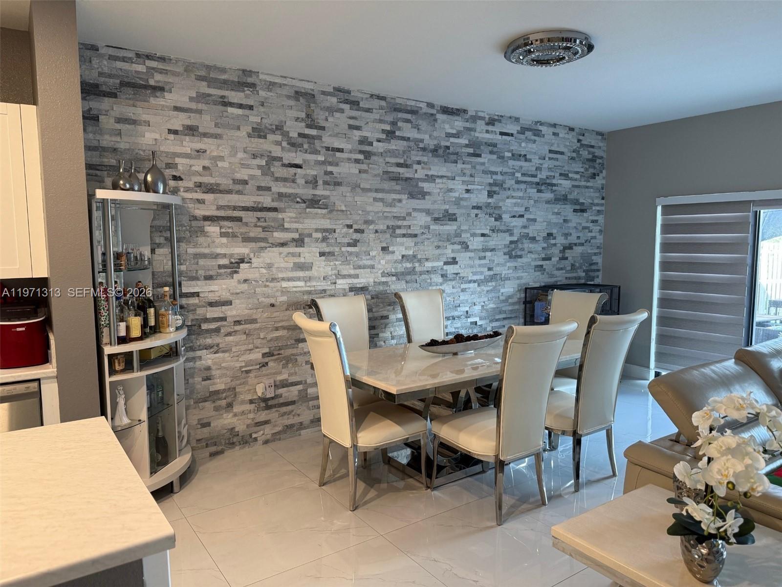 25265 Southwest 109th Avenue, Unit 25265 Homestead, FL 33032 - Photo 8 of 18 a view of a dining room with furniture