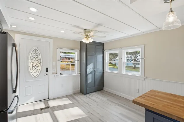 a view of a room with window and cabinet