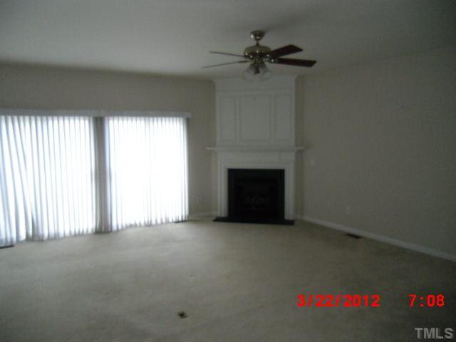7111 Lovko Lane Raleigh, NC 27613 - Photo 3 of 8 a view of empty room with a fireplace