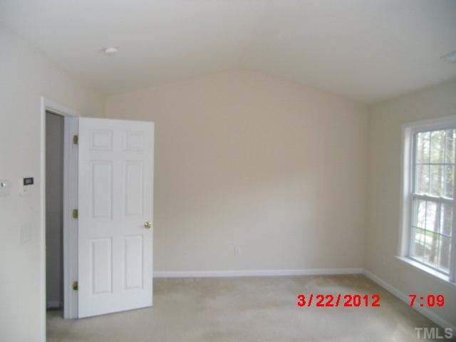 7111 Lovko Lane Raleigh, NC 27613 - Photo 7 of 8 a view of an empty room