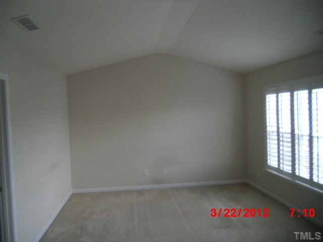 7111 Lovko Lane Raleigh, NC 27613 - Photo 8 of 8 an empty room with a window