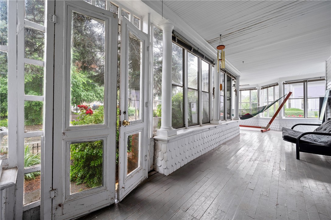 302 Providence Street Woonsocket, RI 02895 - Photo 13 of 38 Wrap Around Glass Enclosed Porch - with Access from Kitchen, Dining Room and Side Door