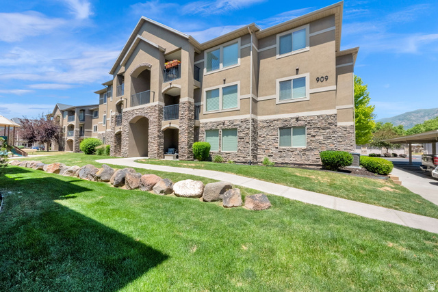 909 South Main Street, Unit G Layton, UT 84041 - Photo 1 of 25 Multi-story building featuring stacked stone and stucco exterior