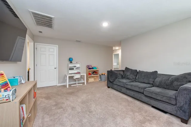 a living room with furniture and a couch