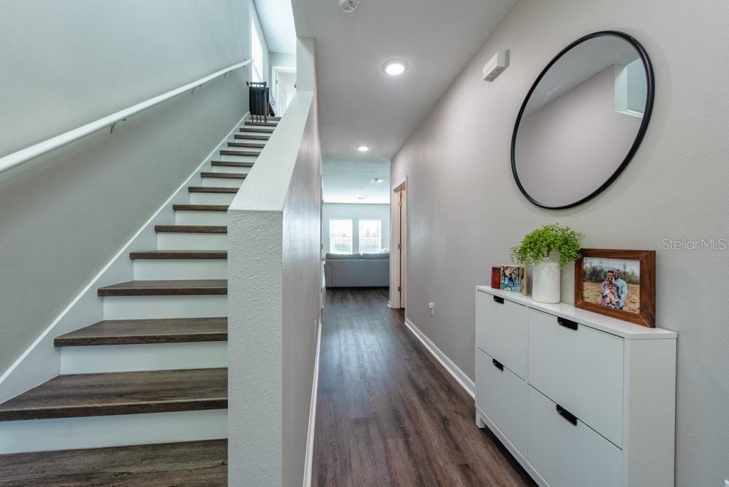 14617 Brumby Ridge Avenue Lithia, FL 33547 - Photo 2 of 46 a view of a hallway with wooden floor and entryway