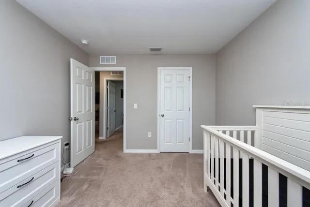 a view of room with closet and windows