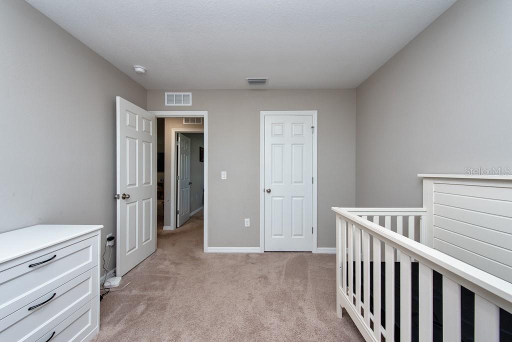 14617 Brumby Ridge Avenue Lithia, FL 33547 - Photo 25 of 46 a view of room with closet and windows