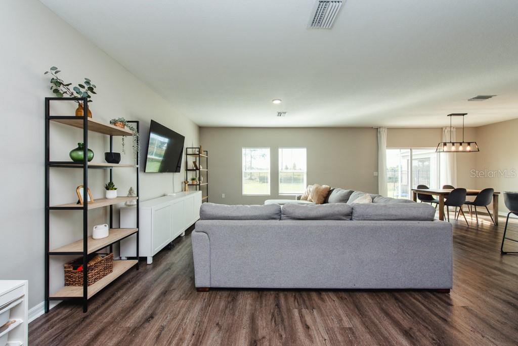 14617 Brumby Ridge Avenue Lithia, FL 33547 - Photo 3 of 46 a living room with furniture and wooden floor