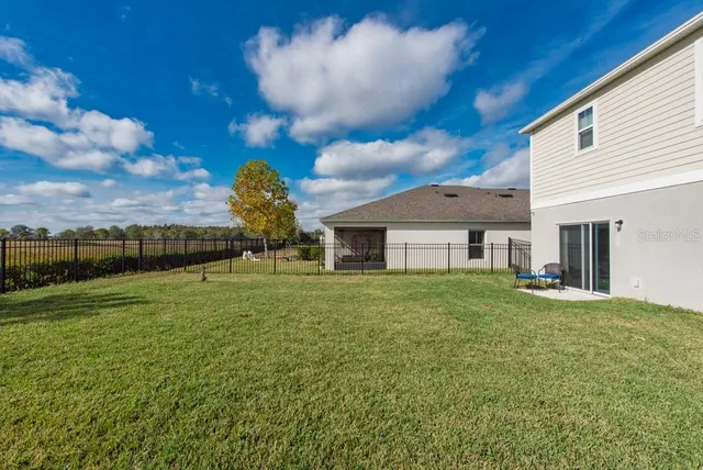 a view of a house with a big yard