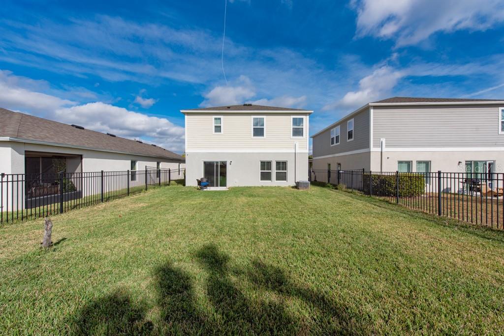 14617 Brumby Ridge Avenue Lithia, FL 33547 - Photo 32 of 46 a front view of a house with a garden