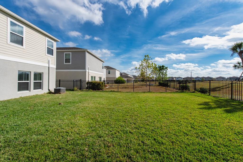 14617 Brumby Ridge Avenue Lithia, FL 33547 - Photo 33 of 46 a view of a house with a back yard