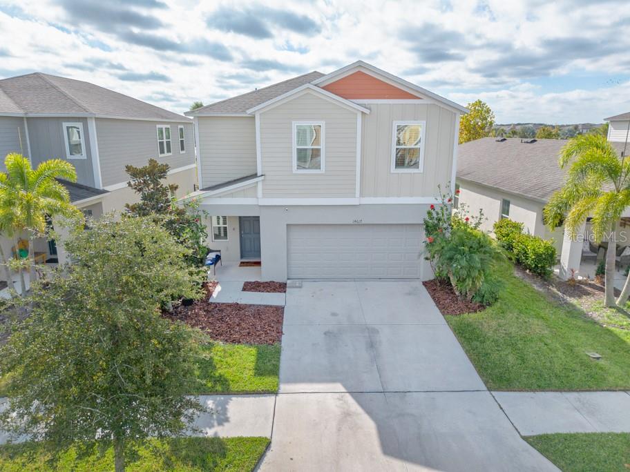14617 Brumby Ridge Avenue Lithia, FL 33547 - Photo 36 of 46 a front view of a house with garden