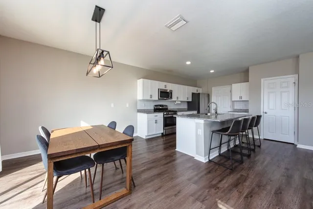 a view of kitchen with breakfast area