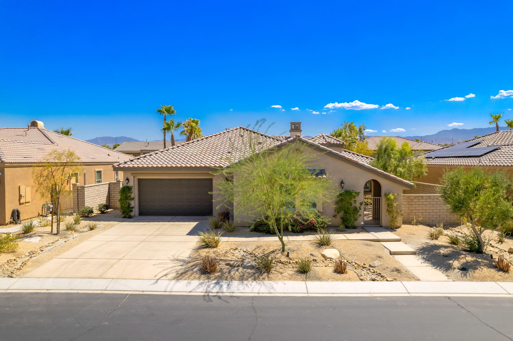 35789 Raphael Drive Palm Desert, CA 92211 - Photo 1 of 15 a view of a house with snow on the road
