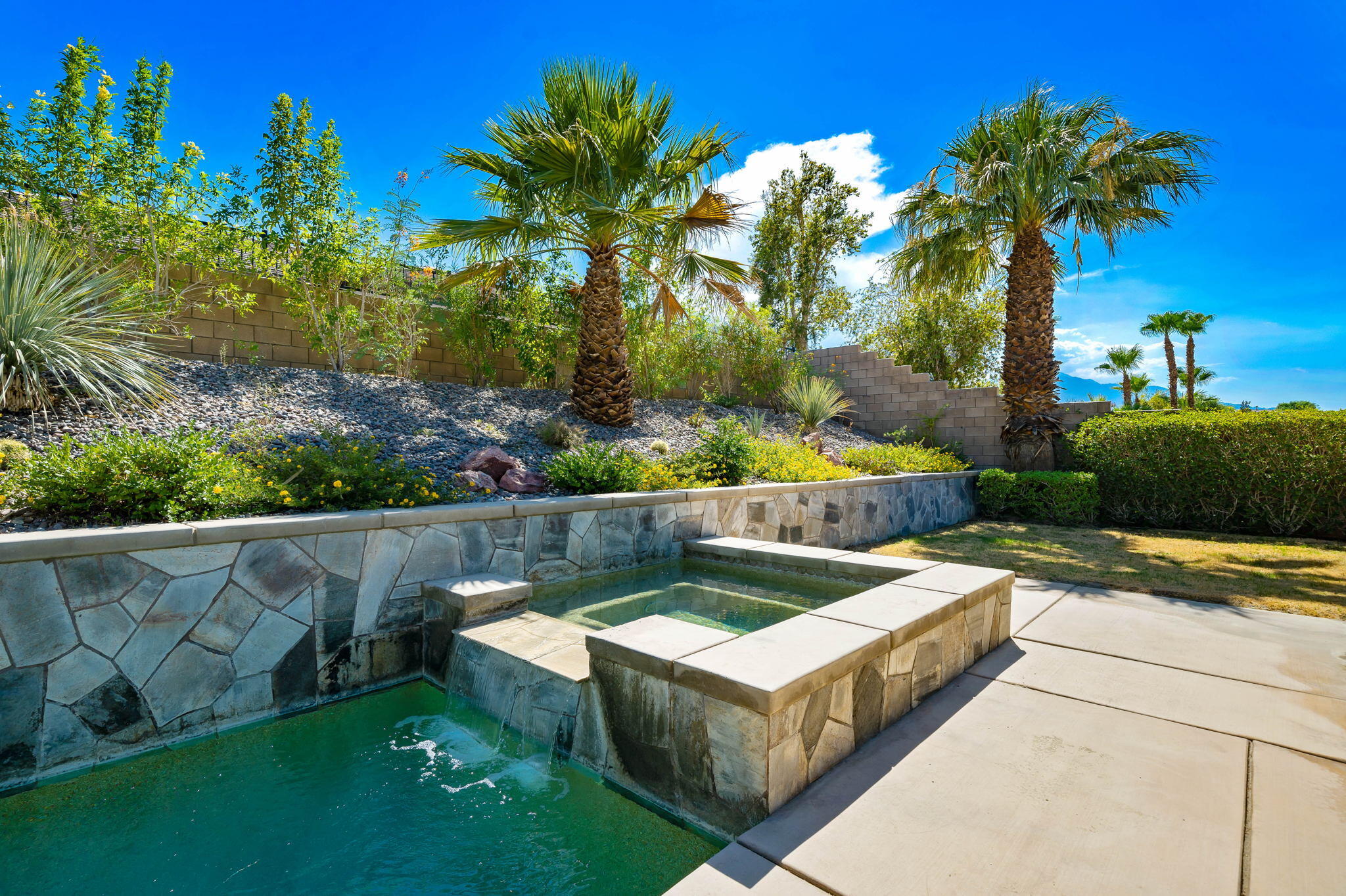 35789 Raphael Drive Palm Desert, CA 92211 - Photo 12 of 15 a view of a garden with a bench