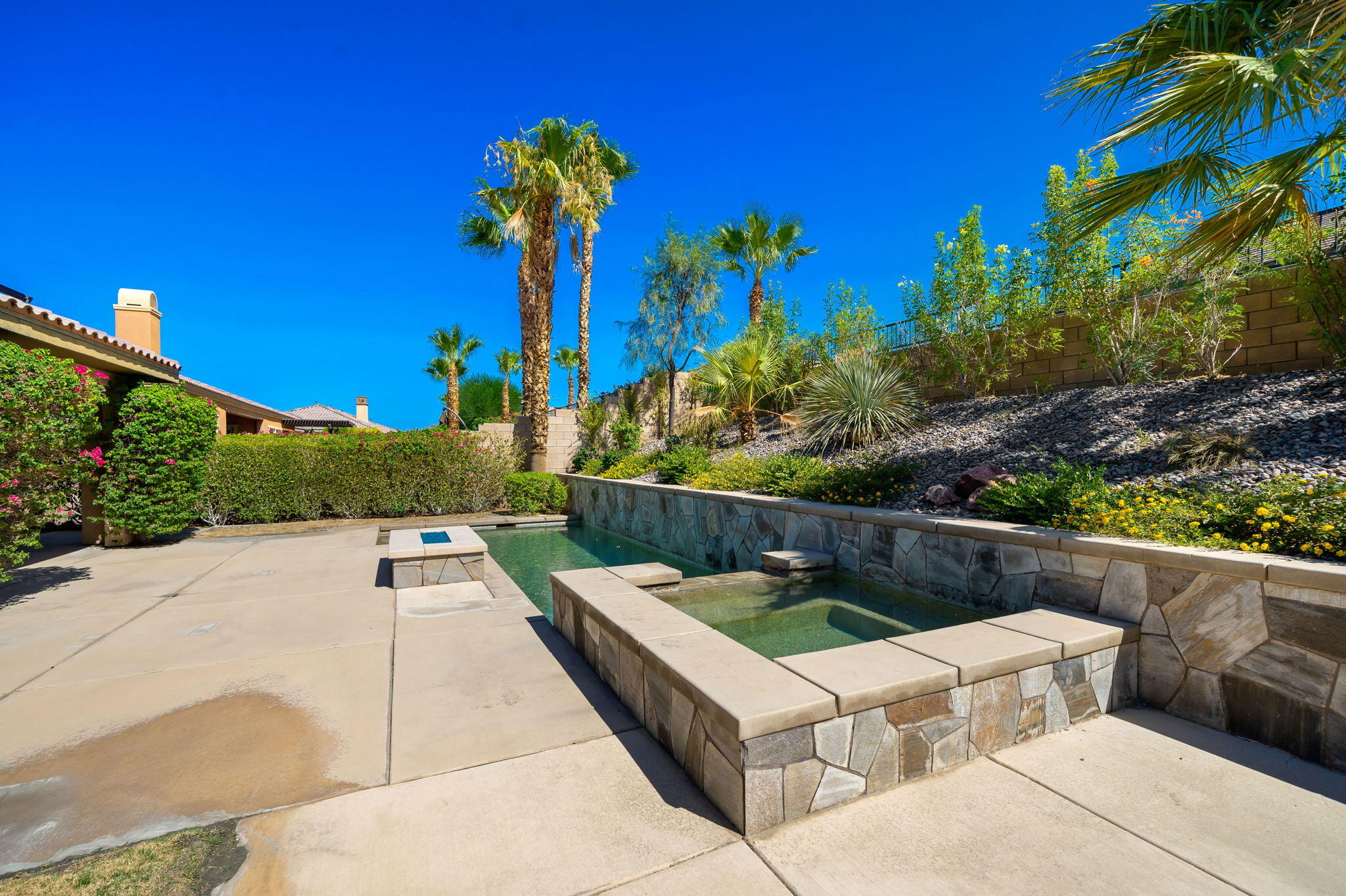 35789 Raphael Drive Palm Desert, CA 92211 - Photo 13 of 15 a view of a chairs and table in a backyard