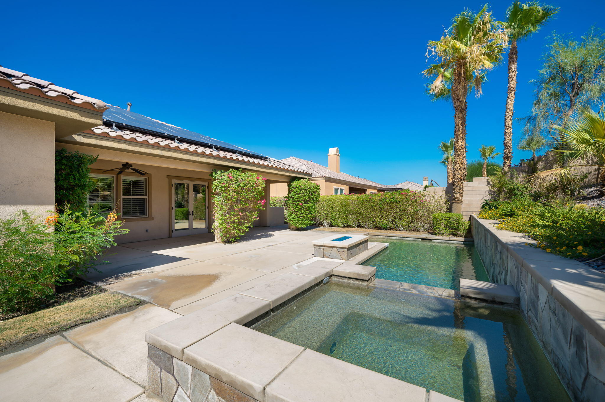 35789 Raphael Drive Palm Desert, CA 92211 - Photo 14 of 15 a view of a house with pool and sitting area