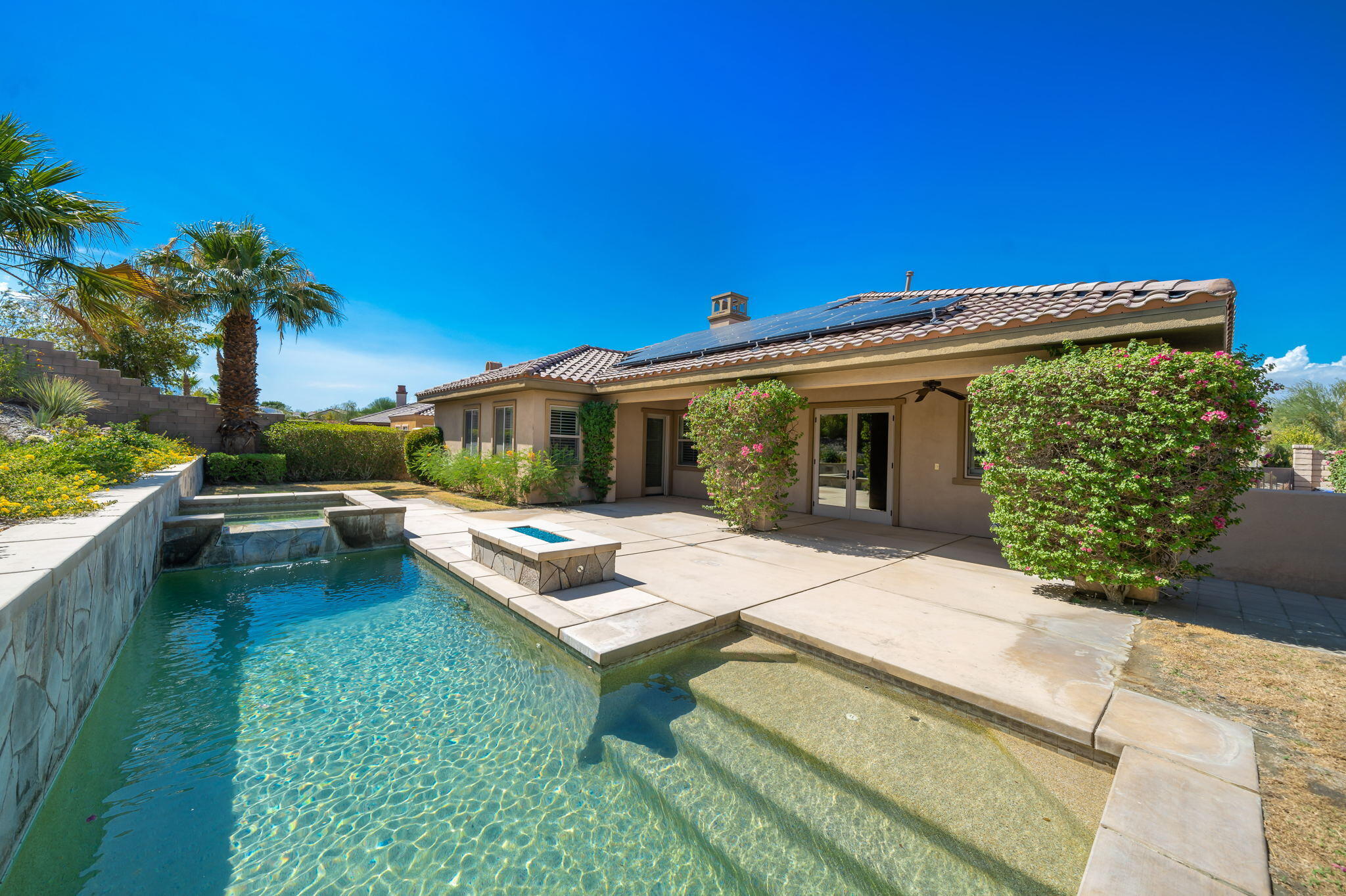 35789 Raphael Drive Palm Desert, CA 92211 - Photo 10 of 15 a view of a house with swimming pool and sitting area