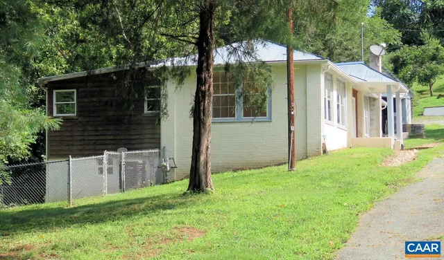 a backyard of a house with seating space