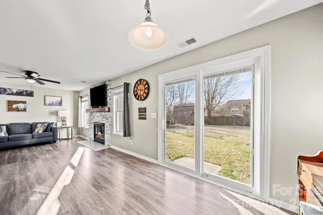 a view of a livingroom with furniture and a fireplace