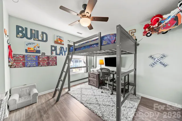 a view of a livingroom with furniture and a flat screen tv