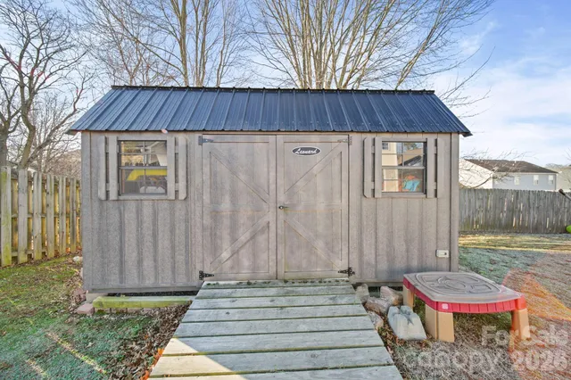 a backyard of a house with seating space