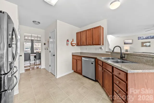a kitchen with a sink stove and refrigerator