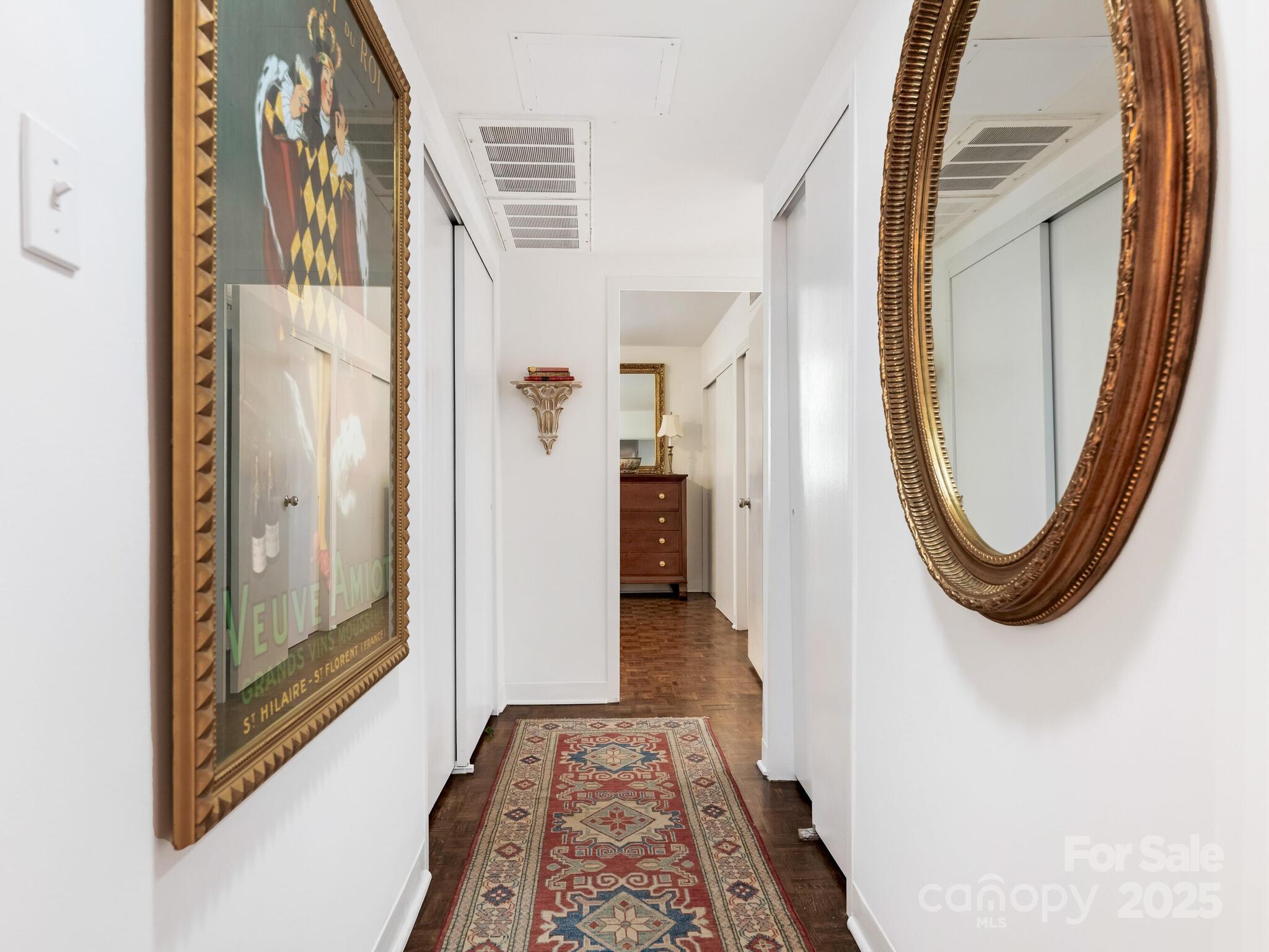 1300 Queens Road, Unit 401 Charlotte, NC 28207 - Photo 13 of 21 view of a hallway with wooden floor and glass door