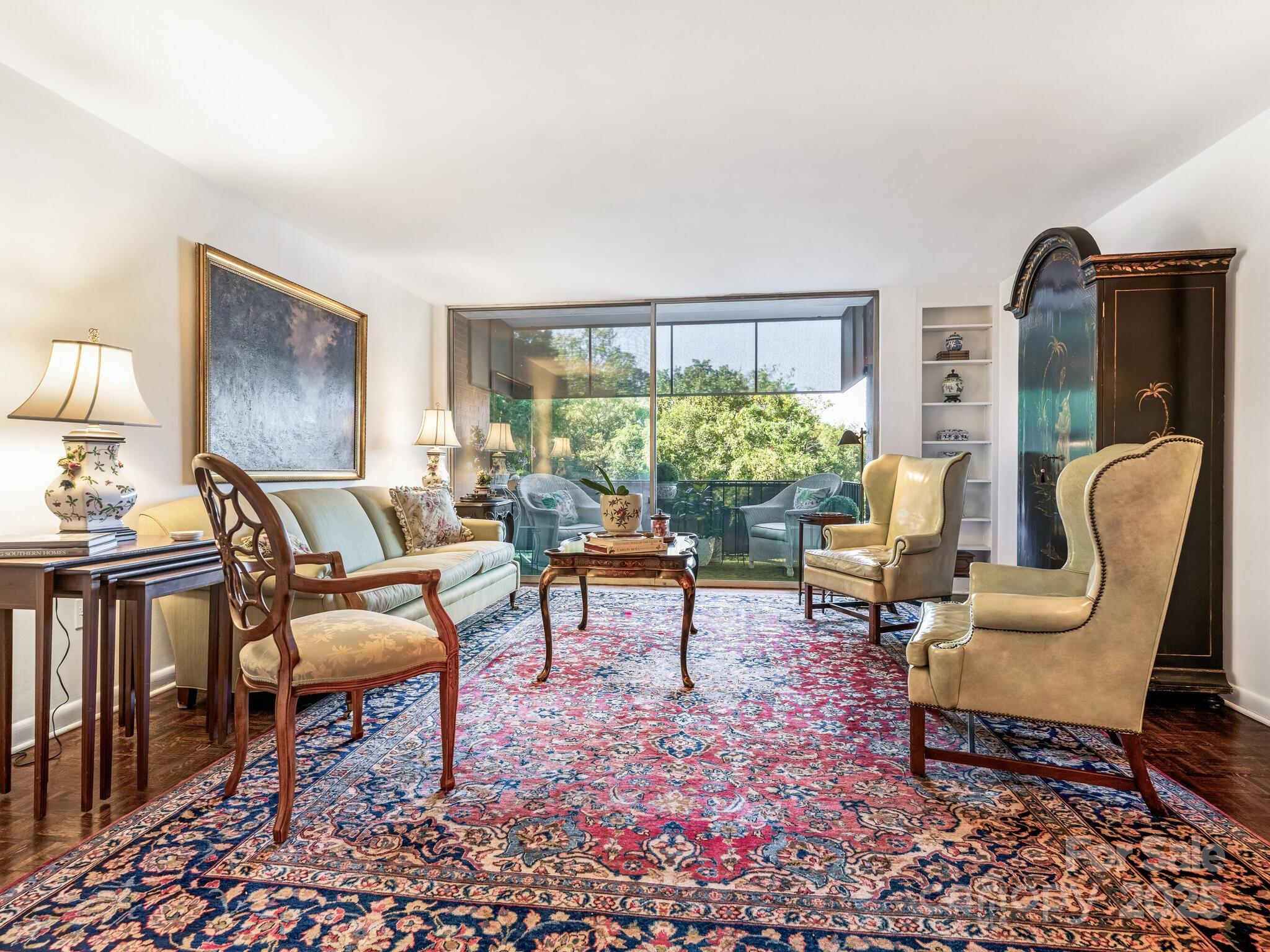 1300 Queens Road, Unit 401 Charlotte, NC 28207 - Photo 2 of 21 a living room with furniture and a potted plant