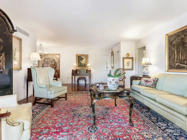 a living room with furniture and a rug