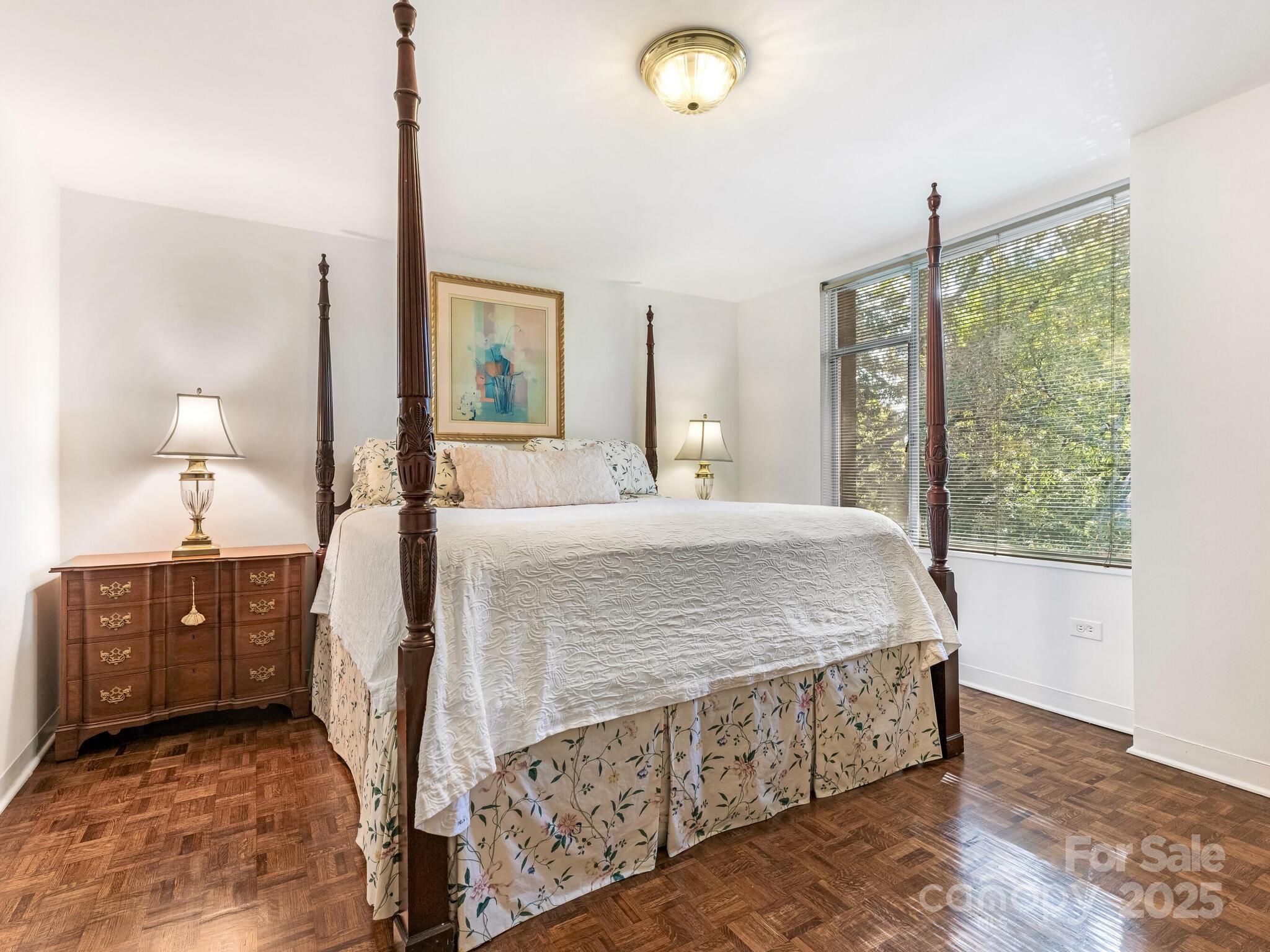 1300 Queens Road, Unit 401 Charlotte, NC 28207 - Photo 7 of 21 a bedroom with a bed dresser and window