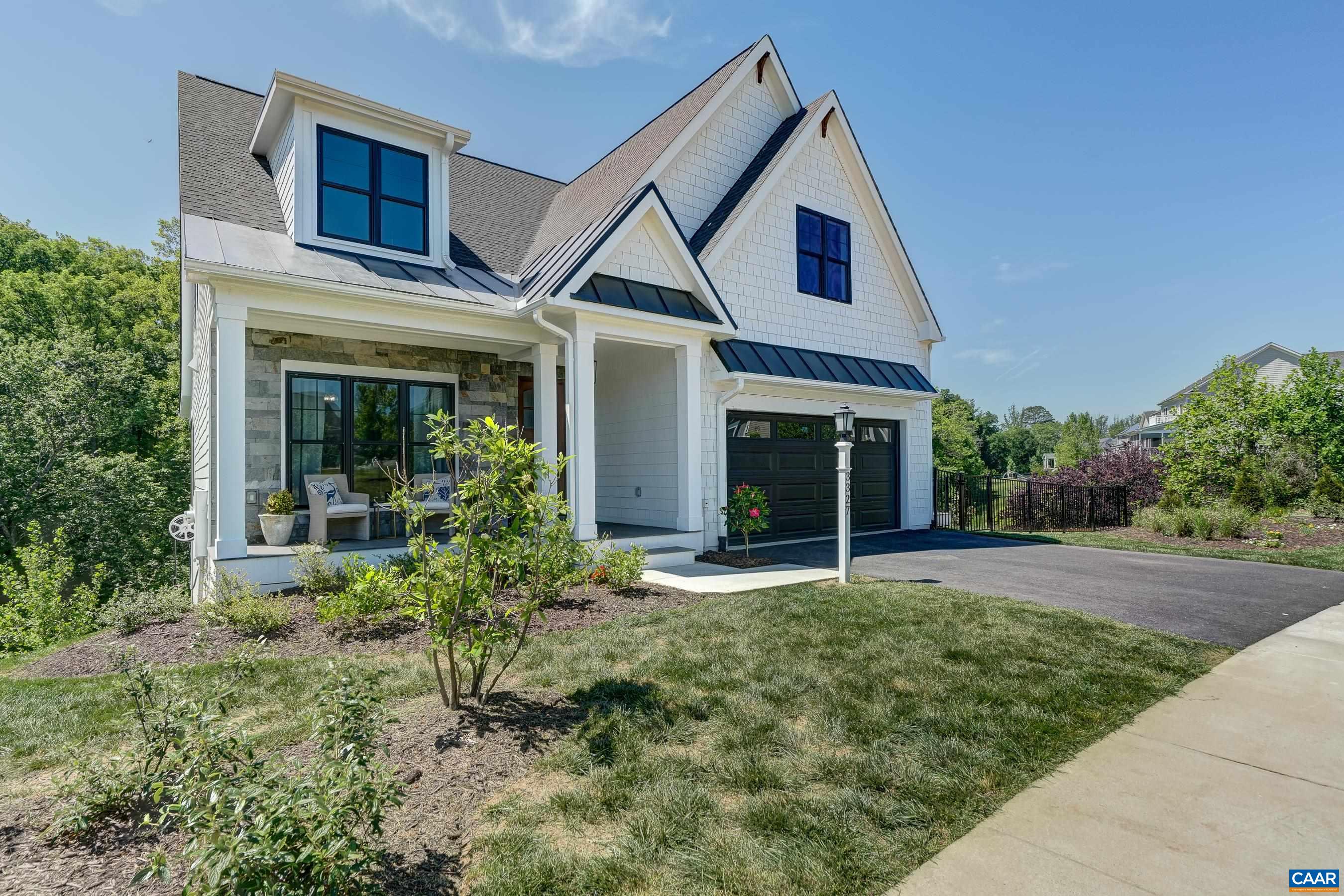 3327 Rowcross Street Crozet, VA 22932 - Photo 2 of 63 Farmhouse charm with low maintenance hardie plank siding, black window frames and carriage style garage door.