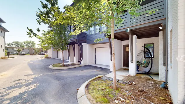 a view of a backyard with table and chairs