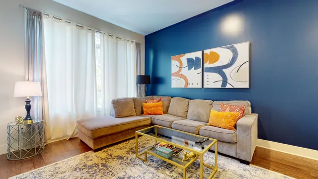 a living room with furniture and a window