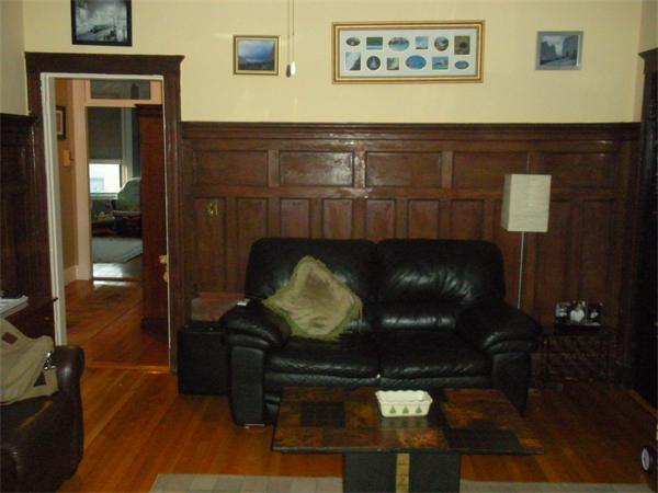 42 Orkney Road, Unit 5 Boston, MA 02135 - Photo 3 of 13 a living room with furniture and a lamp