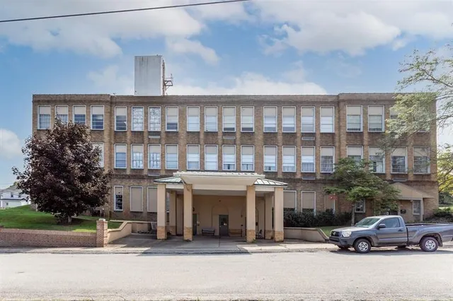 a view of a car park in front of a building