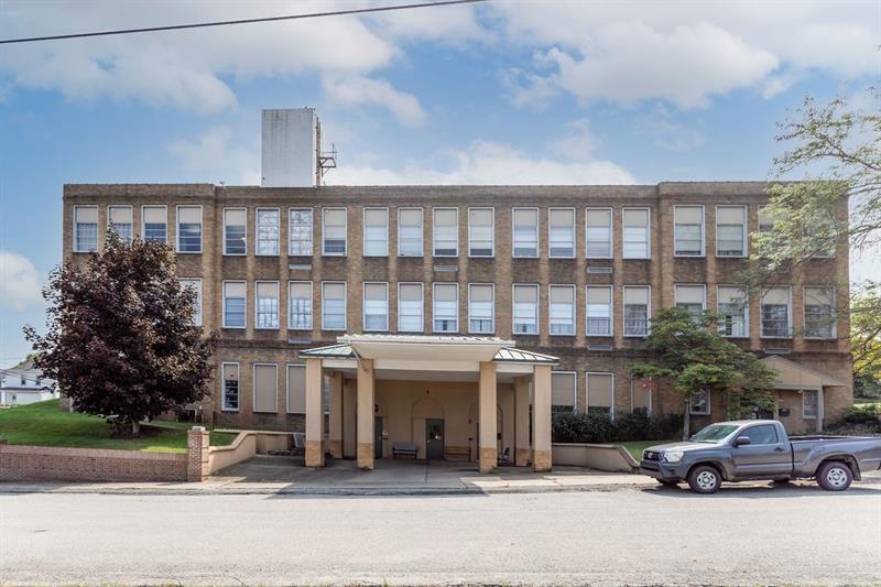 a view of a car park in front of a building