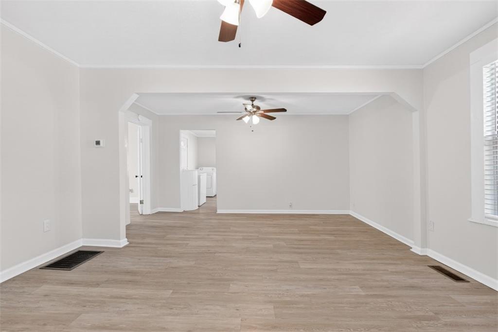 246 Spring Street Commerce, GA 30529 - Photo 3 of 23 wooden floor in an empty room