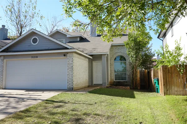 a house with trees in the background