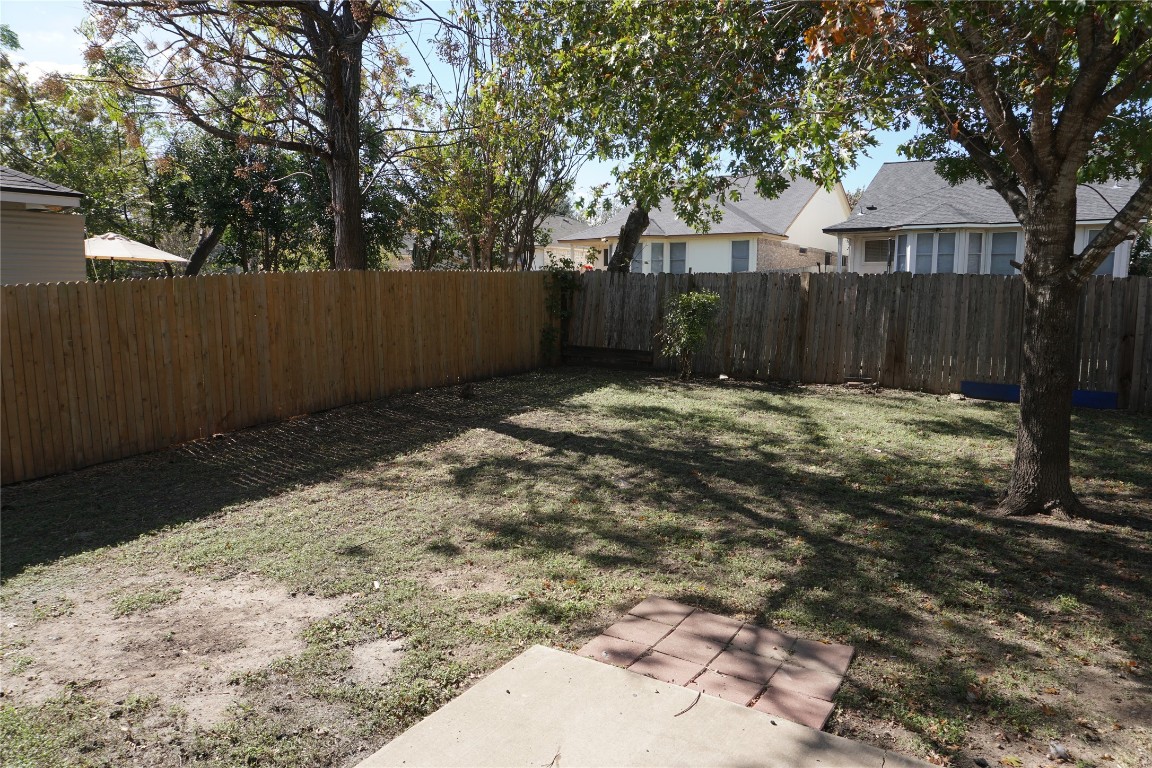 21218 Derby Day Avenue Pflugerville, TX 78660 - Photo 11 of 17 a view of backyard with tree
