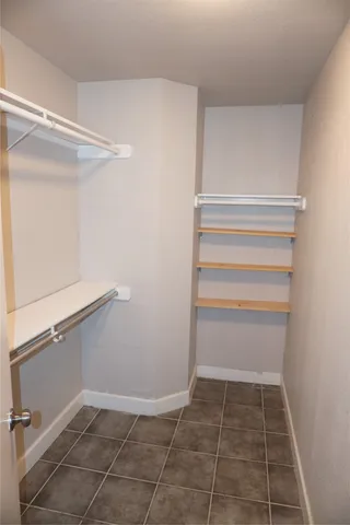 a view of an empty walk in closet