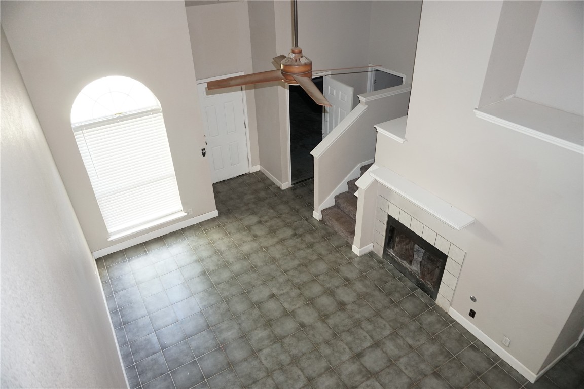 21218 Derby Day Avenue Pflugerville, TX 78660 - Photo 17 of 17 a view of a livingroom with wooden floor and staircase